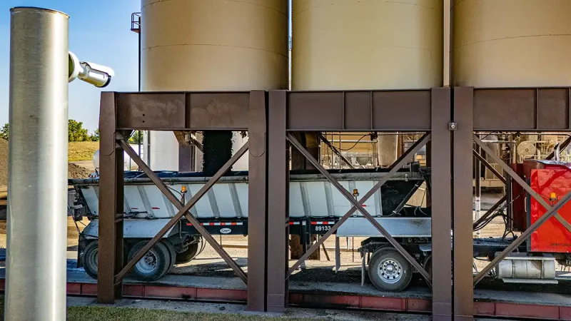 The Look Lock 'n Load silo safety system loading material into a truck bed
